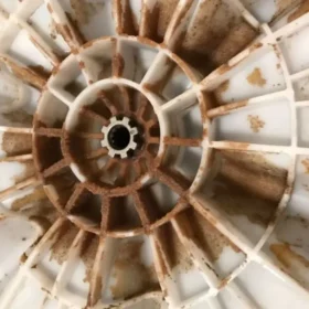 brown flakes in washing machine